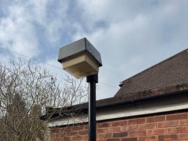 Older post-top light before an external lighting upgrade at a Birmingham school
